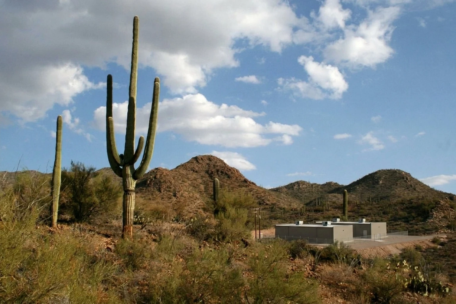 Illustration of a data center facility on open Sonoran Desert land