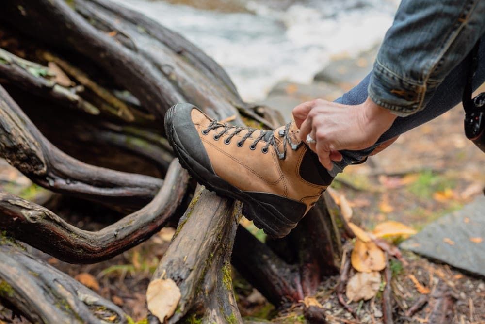 Man tying his hiking boots