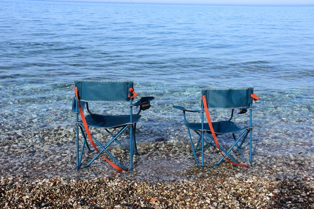 Two camping chairs on the beach