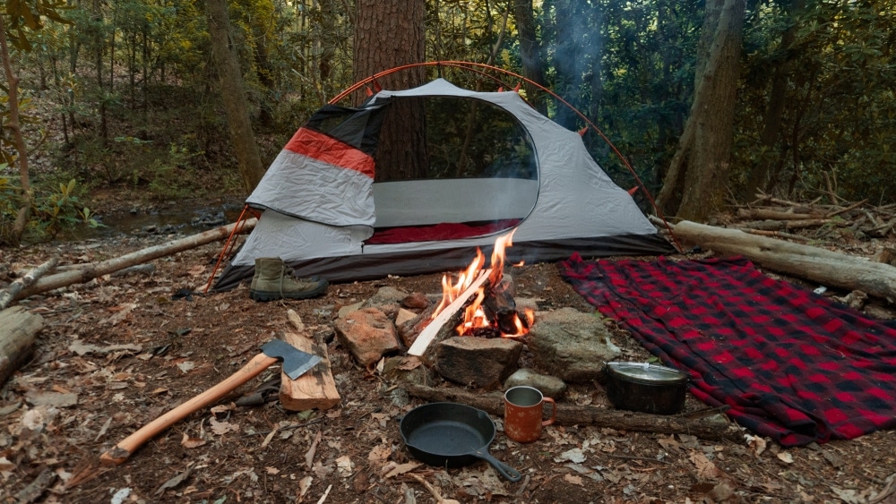 Campfire set up in front of tent