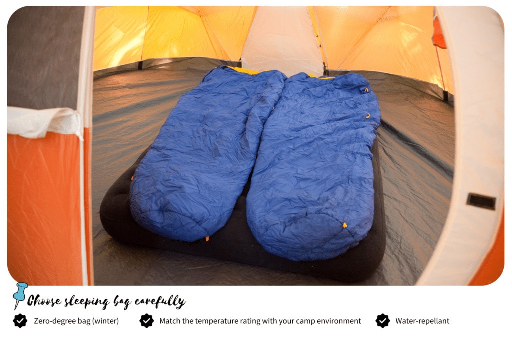 Two blue sleeping bag inside the tent