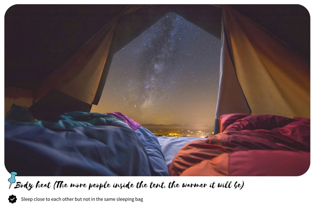 Two sleeping bags inside the tent with a starry night view