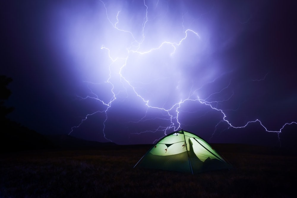 Sky with lightning and camping tent