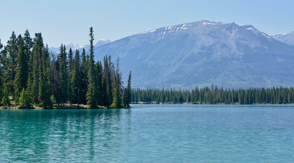 a calm ypsilon lake in rocky mountain national park during summer