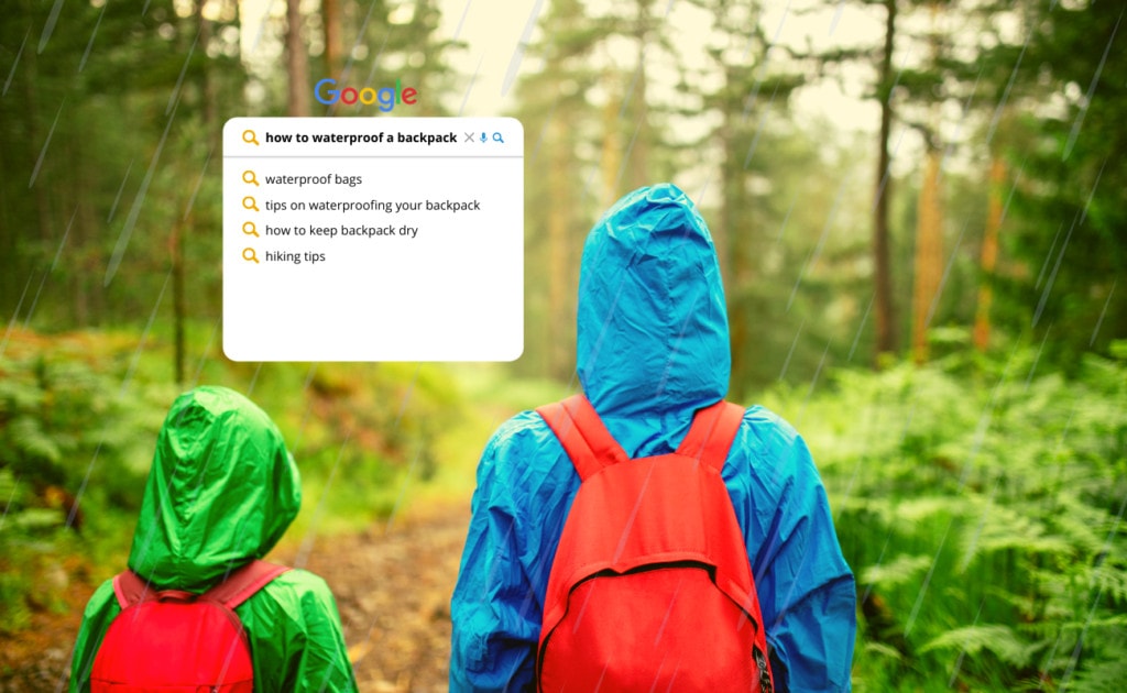 Couple hiking with backpack with google searching