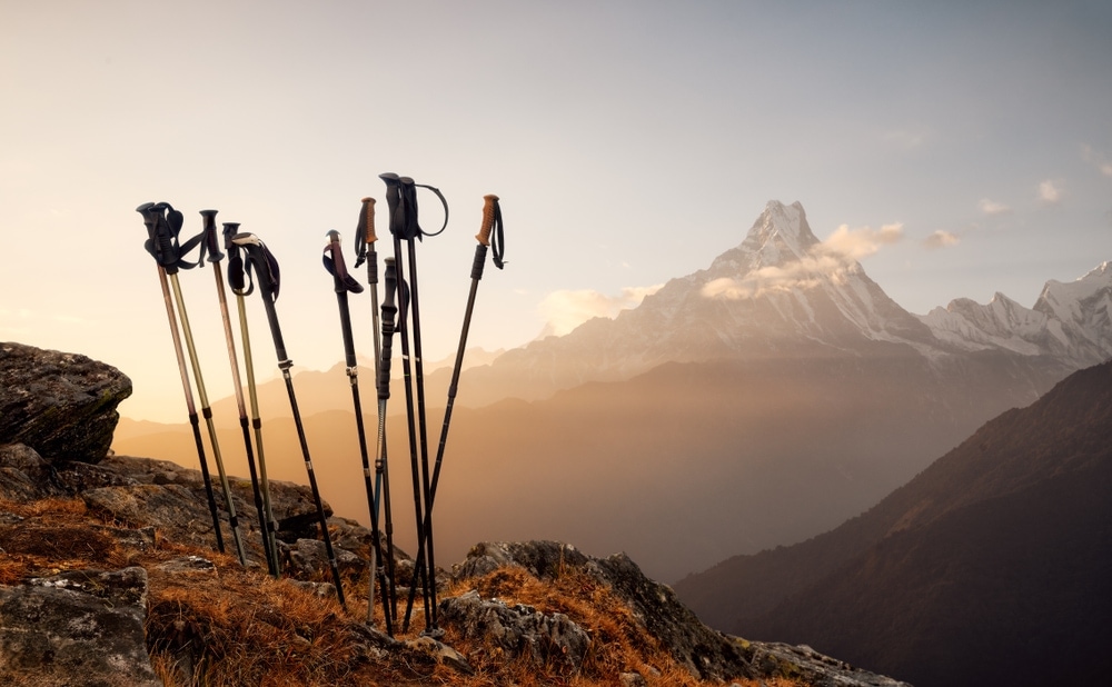 Group of hiking poles on a cliff