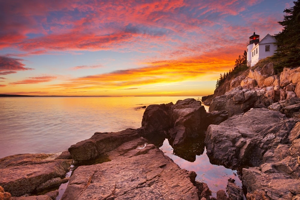 Sunset at The Bass Harbor Head Lighthouse in one of the US national Parks, Acadia National Park, Maine, USA.
