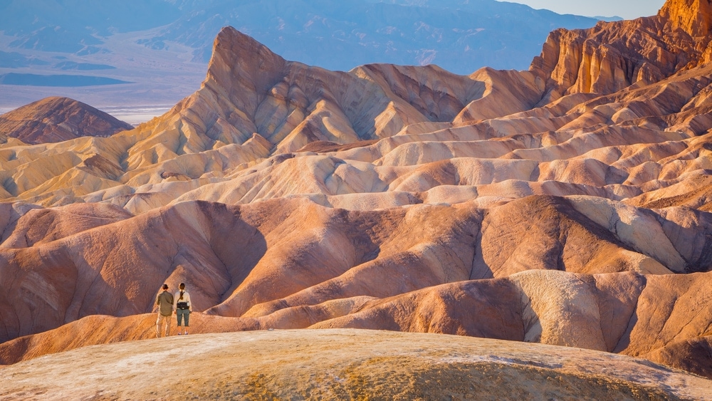 hikers at scenic view in Death Valley National Park, USA