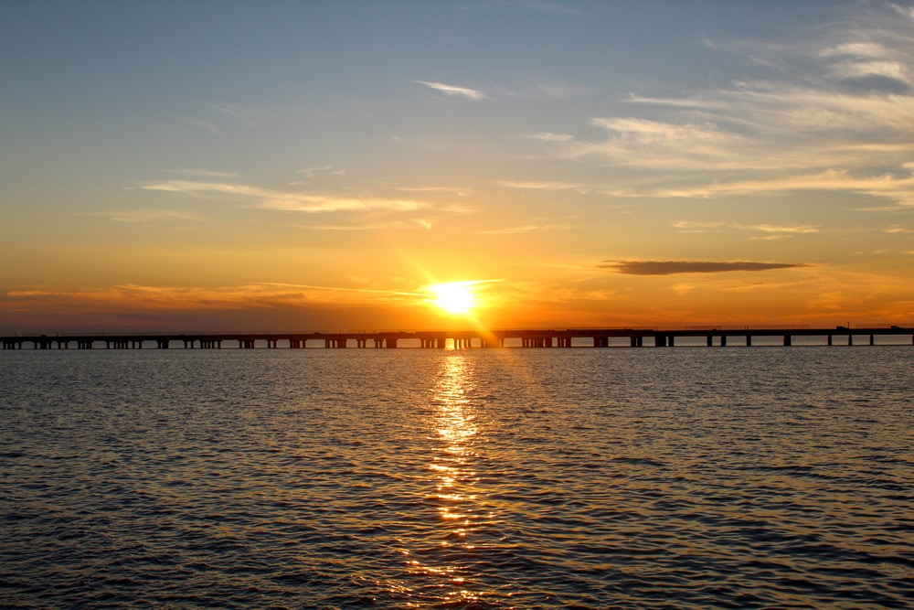 Lake Pontchartrain of Louisiana with sunset on the bridge