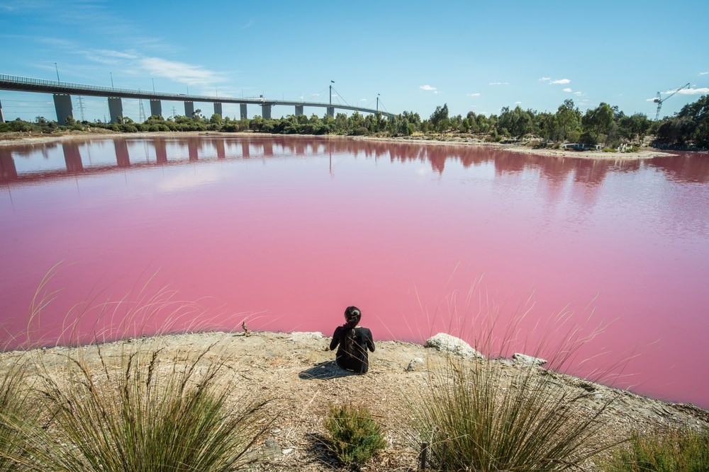 Woman looking at the red lake in the us