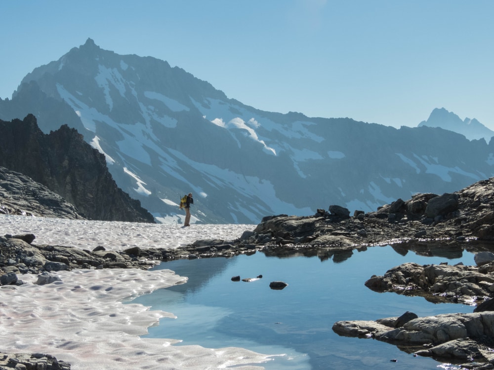 Buckner Mountain in Washington with a man strolling in snow