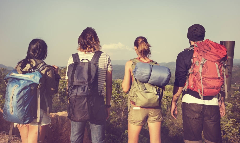 a group of friends with different styles of camping backpack