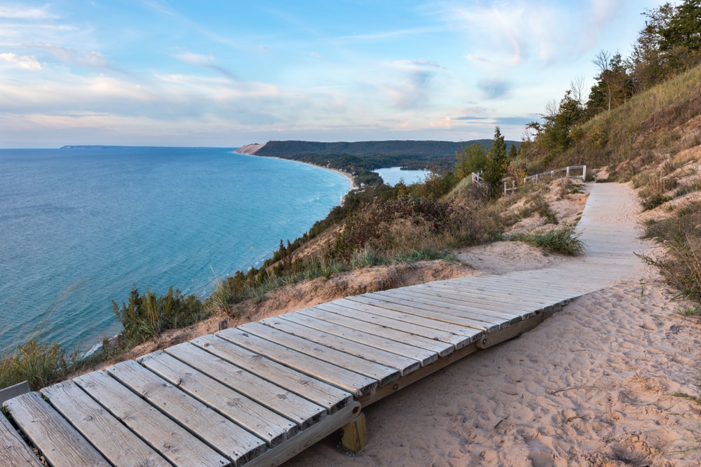 wooden walkway on the Empire Bluffs Trail overlooking the  Lake Michigan, the Sleeping Bear Dunes, and the Manitou island
