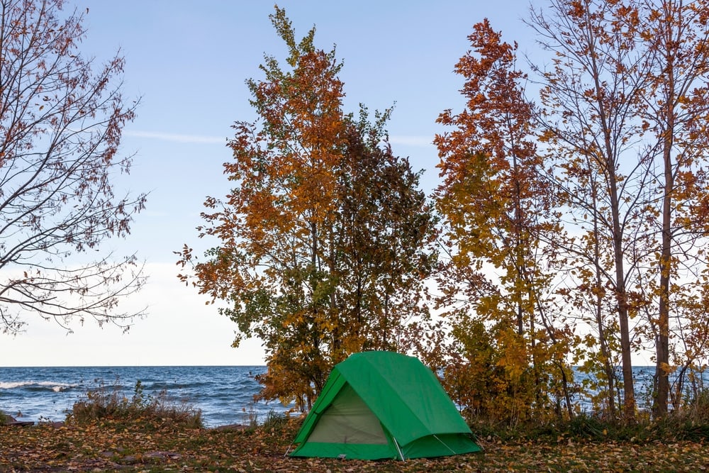 A Green Tent Pitched under Autumn Colors on Lake Superior in the Upper Peninsula of Michigan