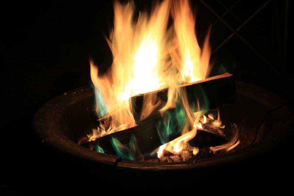 close up image of a campfire with blue flames to know how hot is a campfire