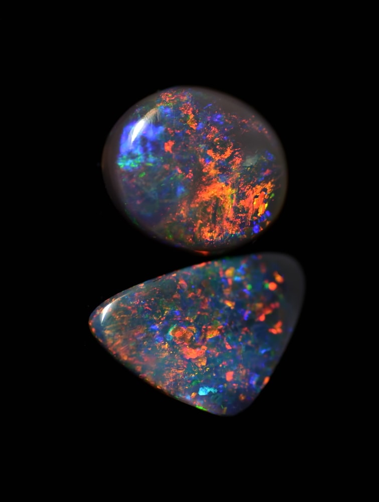 image of black opal gem stones from Australia. Black opals are one of the rarest types of gems
