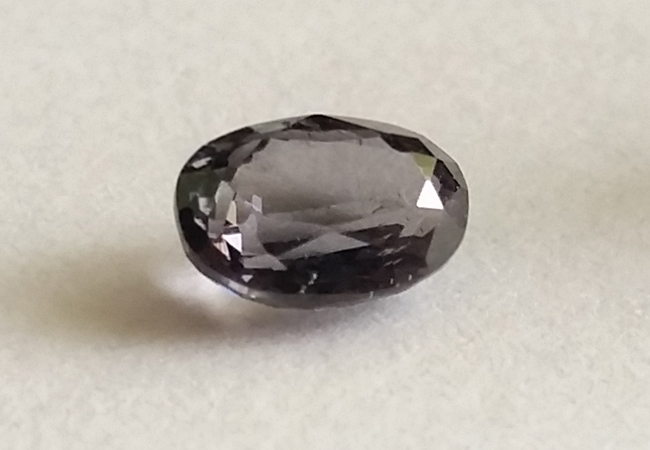 one of the rarest types of gems , the musgravite stone on a white background