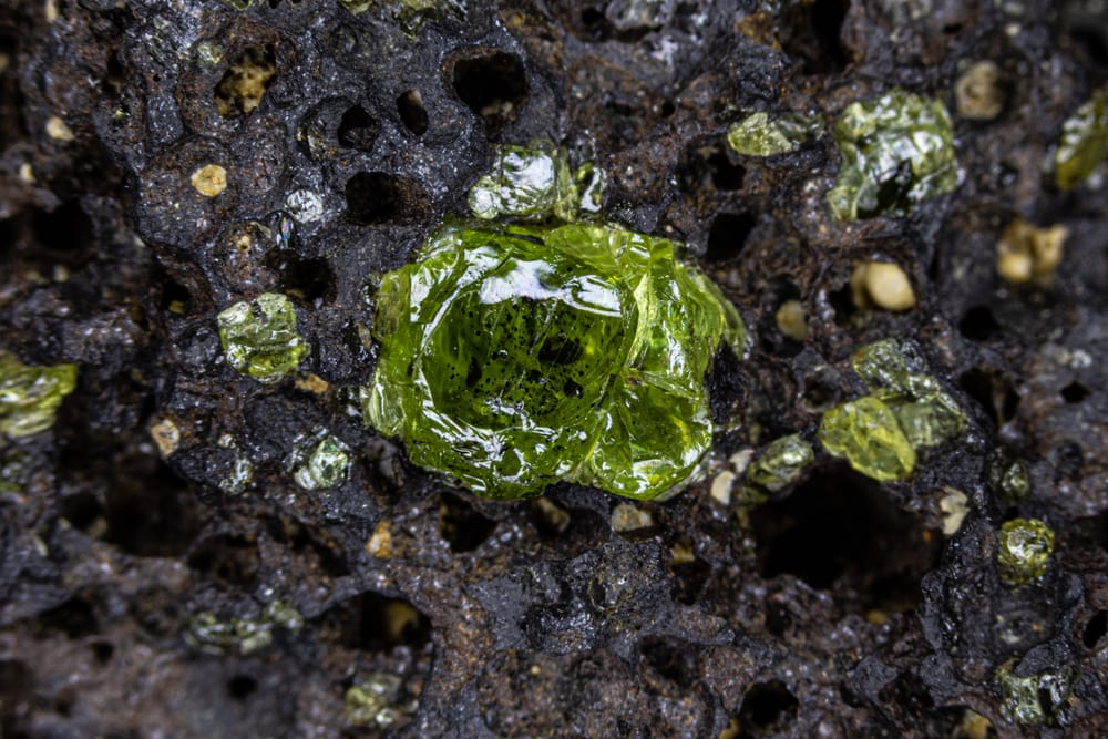 a natural peridot attached to a volanic rock in Hawaii