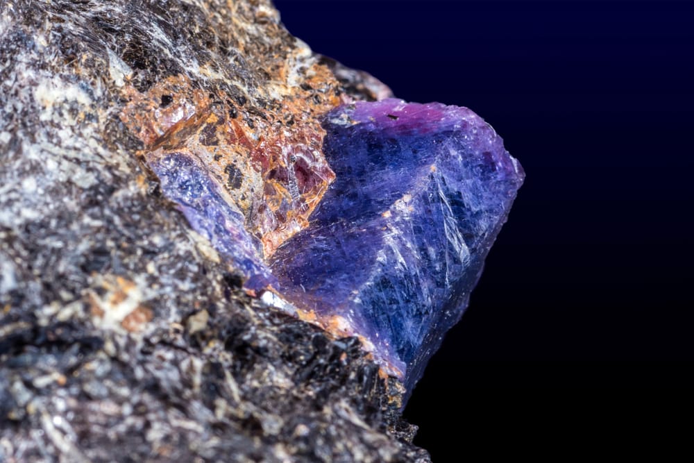 Sapphire is one of the most famous types of gems. Macroshot of uncut and natural sapphire gems