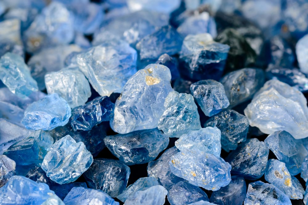 Set of uncut, rough and raw blue sapphires.
