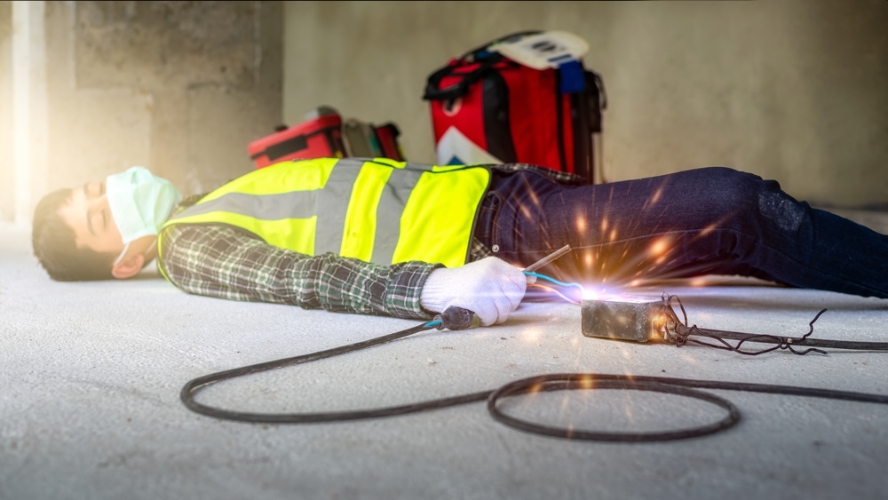 Construction worker carelessly connect wires causing unconscious electric shocks