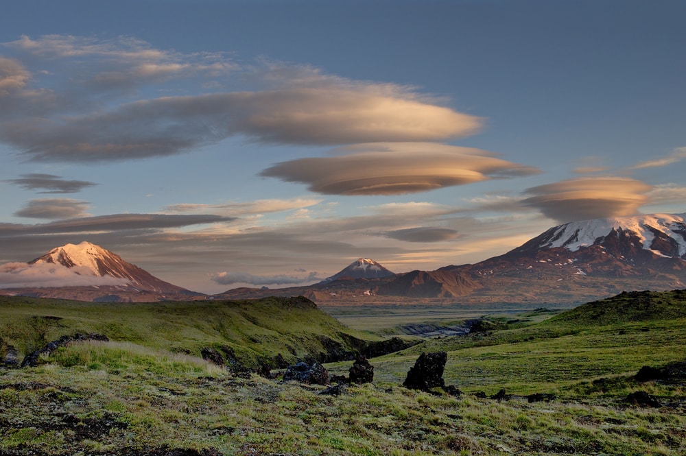 Lenticular clouds on top of mountains