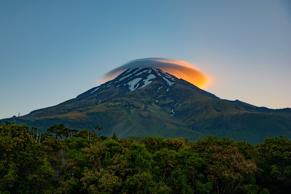 Lenticular Clouds covering the top of a mountain