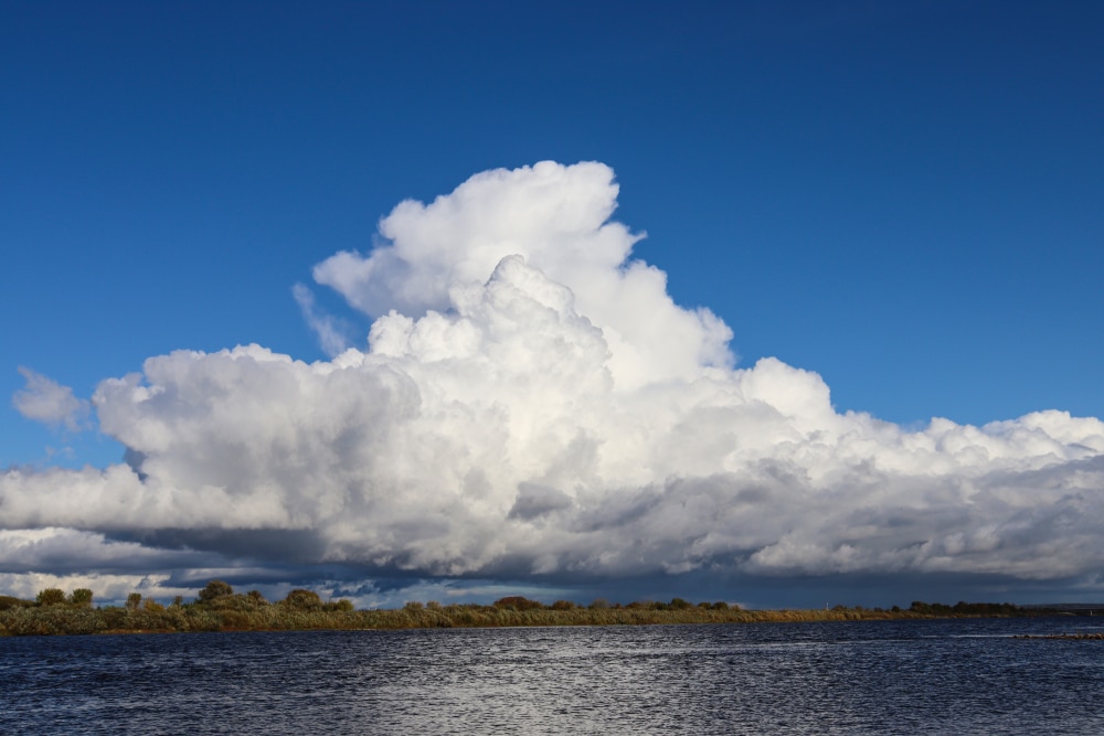 Cumulonimbus Clouds on top of a river