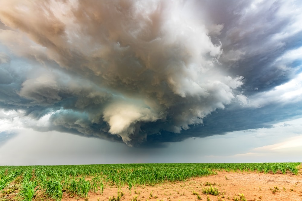 a massive mesocyclone weather supercell, which is a pre-tornado stage, passes over a grassy part of the Great Plains