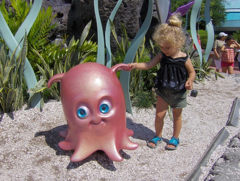 Statue of Pearl the Flapjack Octopus touched by a kid