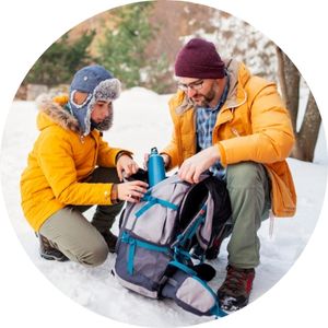 a couple getting ready for winter camping 