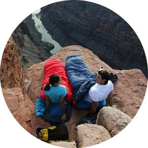 two hikers on a alseeping bag