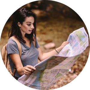 a woman reading a paper map 