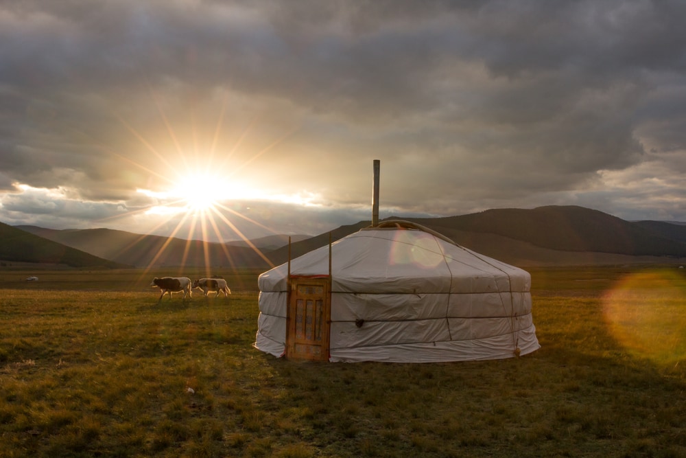 Yurt with sunrise on the mountain