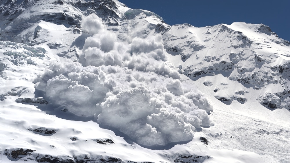 an avalanche running from from the mountain slope