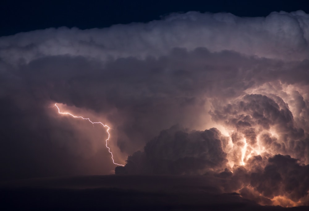 a lightning storm behind the the clouds
