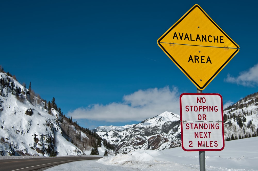 avalanche area sign in a mountain