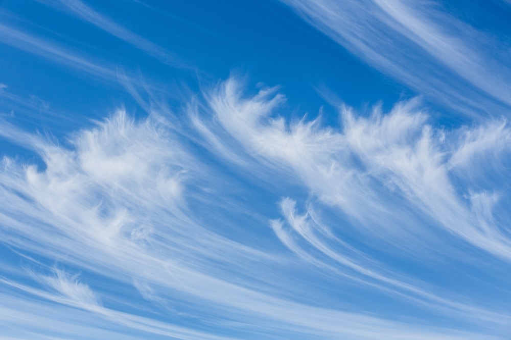 Waves of cirrus clouds on blue sky