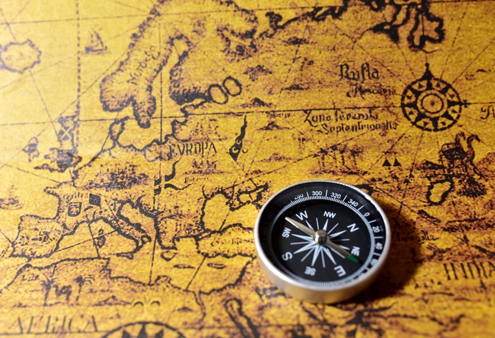 image of a compass and an old map