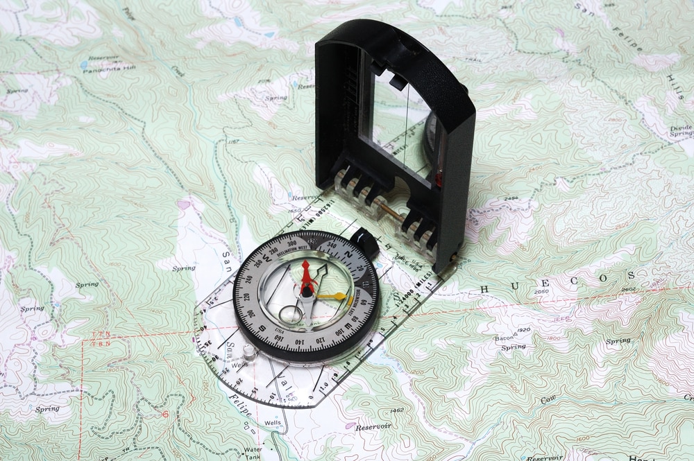 a topographic map and a compass