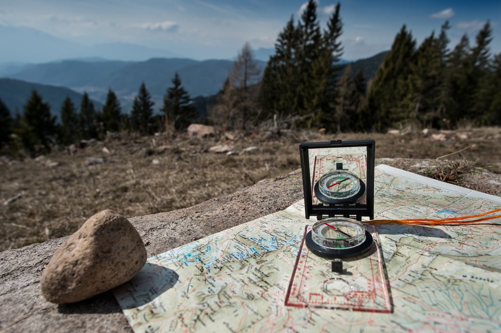 image of a mirrored base plate compass on a map