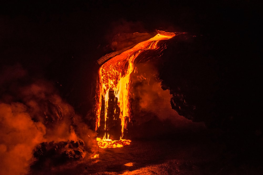 image of a lava flowing off the cliff