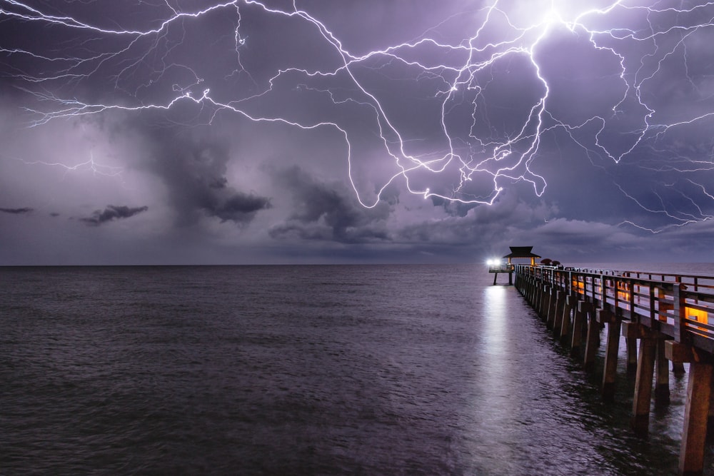 a lightning striking over a gulf
