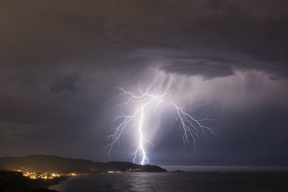 a lightning striking the ocean