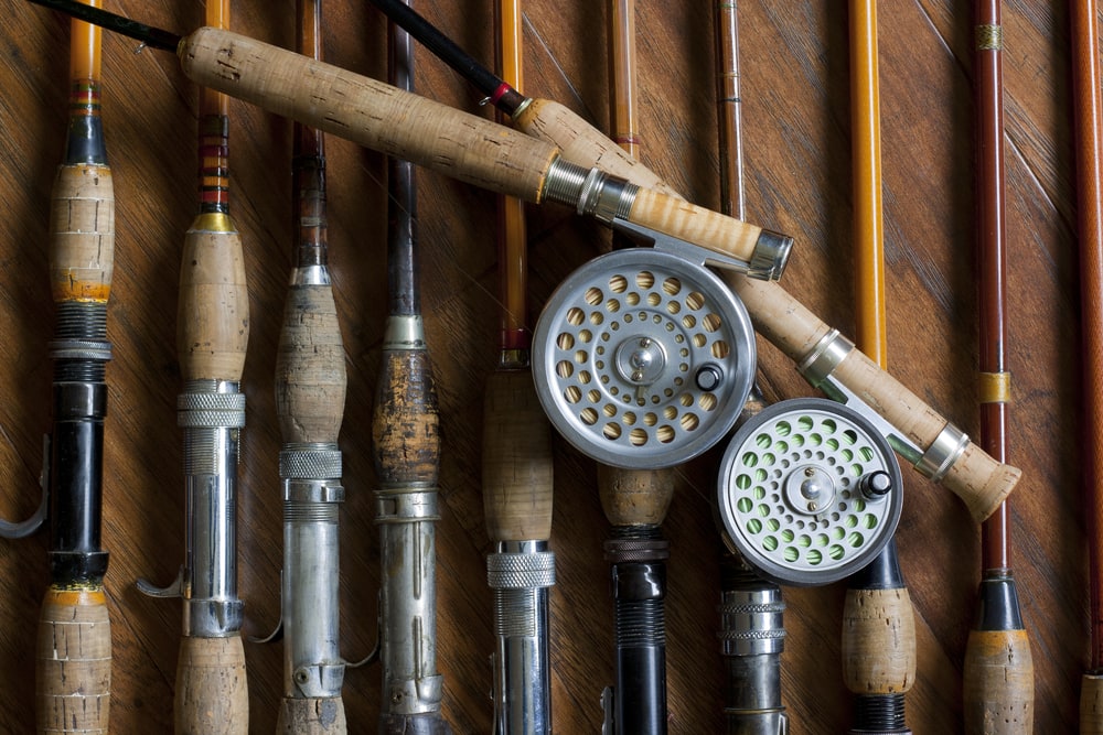 Multiple fly fishing rods laying on a table