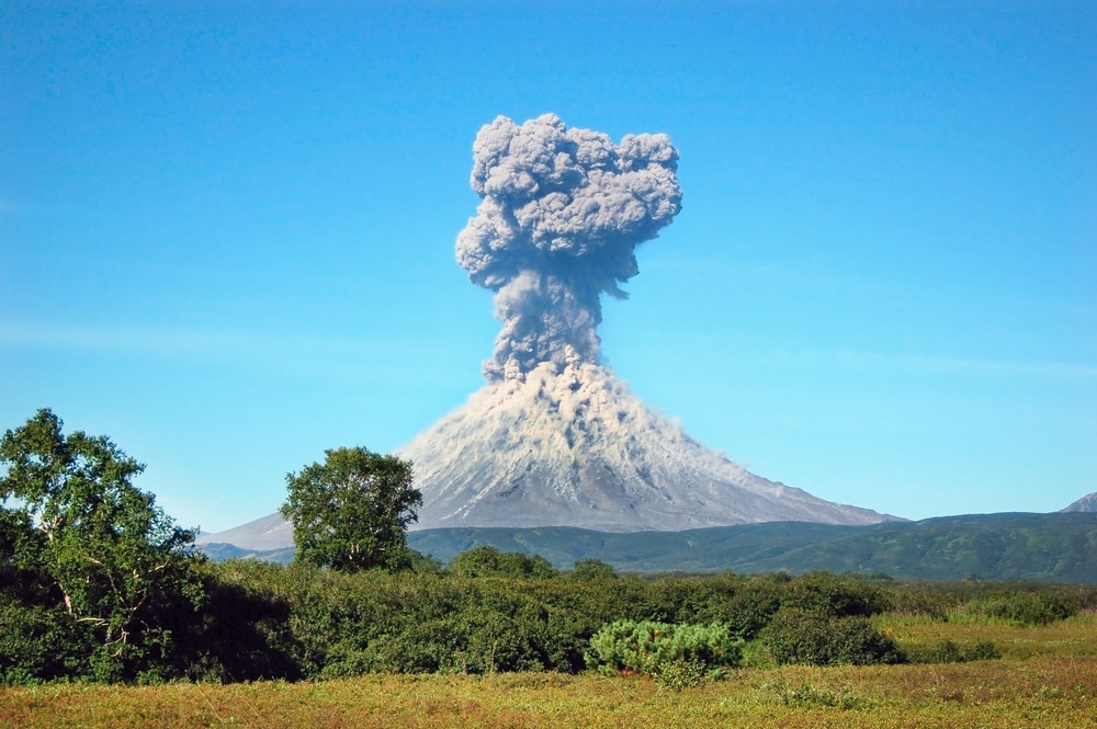 Volcano erupting a huge smoke to the sky