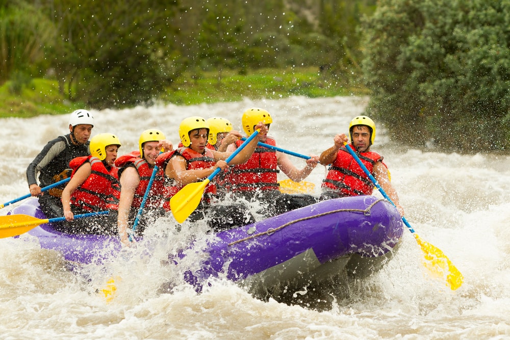 tourists whitewater rafting in Ecuador
