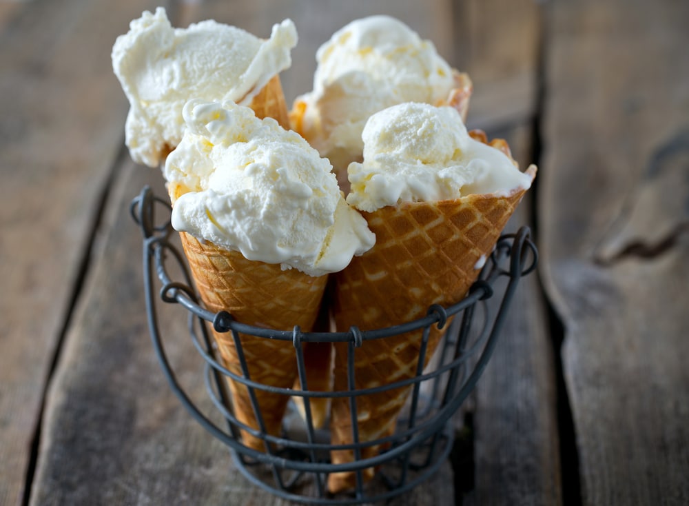 vanilla ice cream on a cone on a table