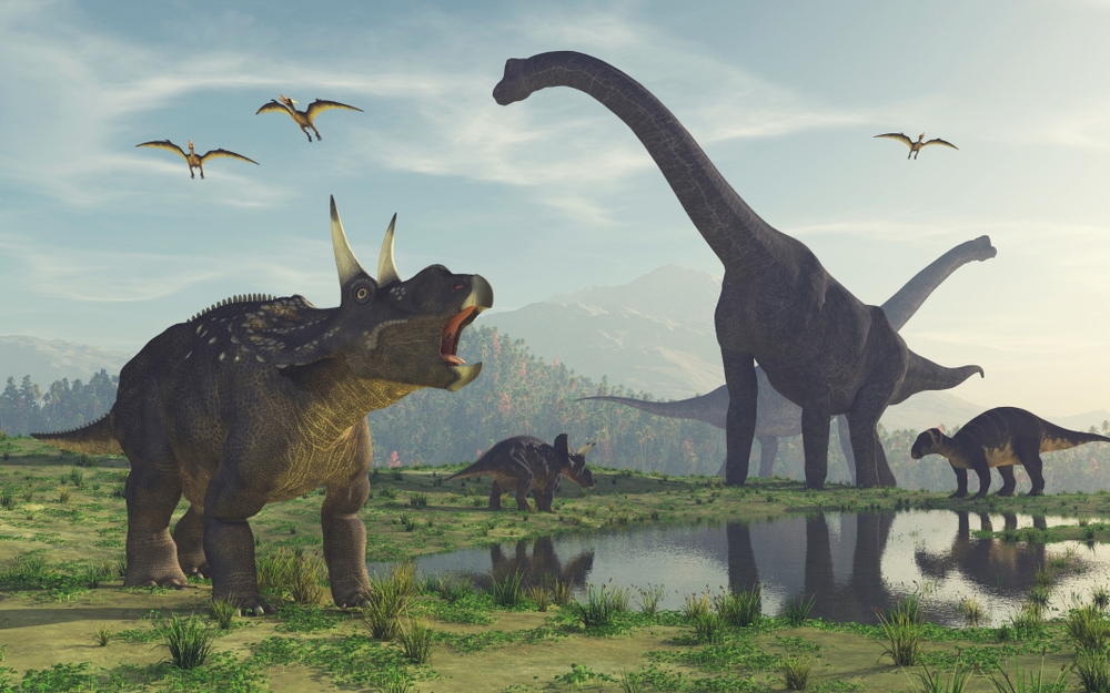Illustration of dinosaurs roaming around the field