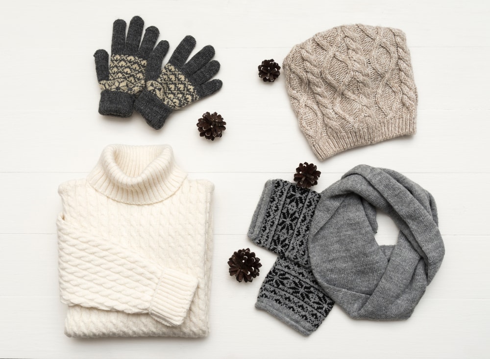 clothes arrangement with hat, mittens, sweater, scarf. flat lay, top view